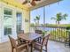 Relaxing screened patio features a tile floor, ceiling fan, and a beautiful water view for enjoying outdoor living at 5623 Jobeth Dr, New Port Richey, FL 34652