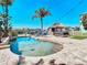 Beautiful backyard oasis with a sparkling pool, tiki hut, and waterfront views, perfect for relaxation at 5623 Jobeth Dr, New Port Richey, FL 34652
