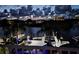 Stunning dockside water view with palm trees lit by tasteful nautical lights at 5623 Jobeth Dr, New Port Richey, FL 34652