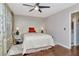 This bedroom features hardwood flooring, soft lighting, and a connecting bathroom at 5850 21St N St # 12, St Petersburg, FL 33714