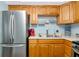A functional kitchen features stainless steel appliances, ample cabinets, and efficient layout at 5850 21St N St # 12, St Petersburg, FL 33714
