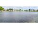 Scenic view of a community pond with fountain feature surrounded by residential buildings at 5850 21St N St # 12, St Petersburg, FL 33714