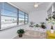 Inviting sunroom with lots of windows, neutral tones and space for several plants at 5850 21St N St # 12, St Petersburg, FL 33714