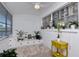 This sunroom is light and bright, with a ceiling fan and neutral flooring at 5850 21St N St # 12, St Petersburg, FL 33714
