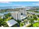 Stunning aerial view of luxury condominium complex surrounded by lush landscaping and beautiful waterfront views at 5940 Pelican Bay S Plz # 1105, Gulfport, FL 33707