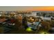 An aerial view of the neighborhood at dusk, showing waterfront homes with pools and boat docks at 5940 Pelican Bay S Plz # 1105, Gulfport, FL 33707