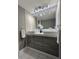 Modern bathroom with double sink vanity, decorative mirror, and stylish hardware at 5940 Pelican Bay S Plz # 1105, Gulfport, FL 33707