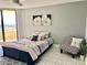Bedroom featuring a ceiling fan, a comfortable bed and balcony access with beautiful views at 5940 Pelican Bay S Plz # 1105, Gulfport, FL 33707