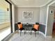 Inviting dining area with table, chairs, bright pillows, and access to the balcony at 5940 Pelican Bay S Plz # 1105, Gulfport, FL 33707