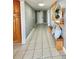 Hallway features neutral colors, tiled floors, built in cabinets, and decorative furnishings at 5940 Pelican Bay S Plz # 1105, Gulfport, FL 33707