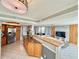 Open kitchen with a breakfast bar seamlessly flowing into the living area at 5940 Pelican Bay S Plz # 1105, Gulfport, FL 33707