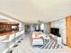 Open living space with bar seating, waterfront views, and modern decor at 5940 Pelican Bay S Plz # 1105, Gulfport, FL 33707