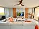 Bright living room featuring contemporary furniture, a modern ceiling fan, and stunning waterfront views at 5940 Pelican Bay S Plz # 1105, Gulfport, FL 33707