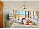 Modern living room with stylish furnishings, and a view of the waterfront from a private balcony at 5940 Pelican Bay S Plz # 1105, Gulfport, FL 33707