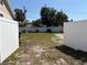 Large backyard with white vinyl fence and gravel area, providing plenty of space for activities at 6221 13Th N Ave, St Petersburg, FL 33710