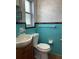 Charming bathroom with vintage blue tile and classic fixtures at 6221 13Th N Ave, St Petersburg, FL 33710