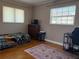 Cozy bedroom with hardwood floors, two windows and simple decor at 6221 13Th N Ave, St Petersburg, FL 33710