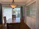 Dining room featuring hardwood floors, chandelier, and a built-in cabinet at 6221 13Th N Ave, St Petersburg, FL 33710