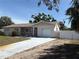 Charming one story home with a driveway and attached garage at 6221 13Th N Ave, St Petersburg, FL 33710