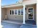 Inviting front porch with brick facade and classic column detail near the entryway at 6221 13Th N Ave, St Petersburg, FL 33710