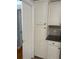 Hallway storage area with many white cabinets at 6221 13Th N Ave, St Petersburg, FL 33710