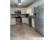 Modern kitchen with stainless steel appliances, granite countertops, and ample cabinet space at 6221 13Th N Ave, St Petersburg, FL 33710