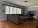 Bright living room with hardwood floors and large window providing ample natural light at 6221 13Th N Ave, St Petersburg, FL 33710