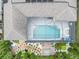 Aerial view of a screened-in pool and landscaped backyard at 6313 Brevada Ln, Apollo Beach, FL 33572