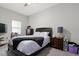 Comfortable bedroom with neutral walls, ceiling fan and a window for natural light at 6313 Brevada Ln, Apollo Beach, FL 33572