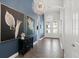 Stylish foyer with tiled flooring, elegant lighting fixtures, and attractive wall art at 6313 Brevada Ln, Apollo Beach, FL 33572