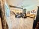 Spacious living room with modern furnishings, tiled floors, and a view of the kitchen at 6313 Brevada Ln, Apollo Beach, FL 33572