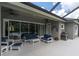 Relaxing outdoor patio with a ceiling fan, comfortable seating and a grill at 6313 Brevada Ln, Apollo Beach, FL 33572