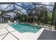 Inviting in-ground pool with barstool seating and a pergola at 6313 Brevada Ln, Apollo Beach, FL 33572