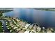 Stunning aerial view of a waterfront community with private boat docks and lush landscaping at 684 Regatta Way, Bradenton, FL 34208
