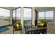 Relaxing outdoor patio with modern seating overlooking the water and greenery at 684 Regatta Way, Bradenton, FL 34208
