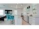 Entertaining room with a wet bar with granite countertops, a TV, and seating at 684 Regatta Way, Bradenton, FL 34208