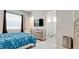 This stylish bedroom features an ensuite bathroom, and mirrored furnishings at 684 Regatta Way, Bradenton, FL 34208