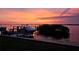 Waterfront property with private dock, boat, and stunning sunset views at 684 Regatta Way, Bradenton, FL 34208