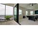 Entertaining room with a balcony overlooking the water, a pool table, and natural light at 684 Regatta Way, Bradenton, FL 34208