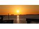 Scenic waterfront view at sunset, overlooking the tranquil water from a dock at 684 Regatta Way, Bradenton, FL 34208