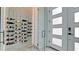 Custom wine cellar with marble accents and modern lighting provides elegant storage for wine collection near the entry at 684 Regatta Way, Bradenton, FL 34208