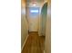 Inviting entryway featuring modern lighting, wood-look flooring, and access to the staircase at 7029 White Treetop Pl, Riverview, FL 33578