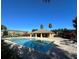 Community pool with blue water, brick surround and a covered pavilion, perfect for relaxing and enjoying the Florida sunshine at 7029 White Treetop Pl, Riverview, FL 33578