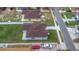 Birds eye view shows roof, fenced yard, landscaping, concrete driveway, and street view of property at 8505 N Brooks St, Tampa, FL 33604