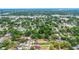 Overhead view of the property in a tree-filled neighborhood, emphasizing its convenient location and access to local amenities at 8505 N Brooks St, Tampa, FL 33604