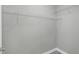 Spacious walk-in closet with white wire shelving and gray walls, offering ample storage at 8505 N Brooks St, Tampa, FL 33604