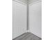 Two new bright closets featuring gray floors, white doors and walls at 8505 N Brooks St, Tampa, FL 33604