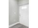 Light gray entryway with white door and vinyl flooring at 8505 N Brooks St, Tampa, FL 33604