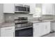 Modern kitchen with stainless steel appliances and granite countertops at 8505 N Brooks St, Tampa, FL 33604