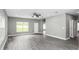 Large living room with fan and views to front yard at 8505 N Brooks St, Tampa, FL 33604